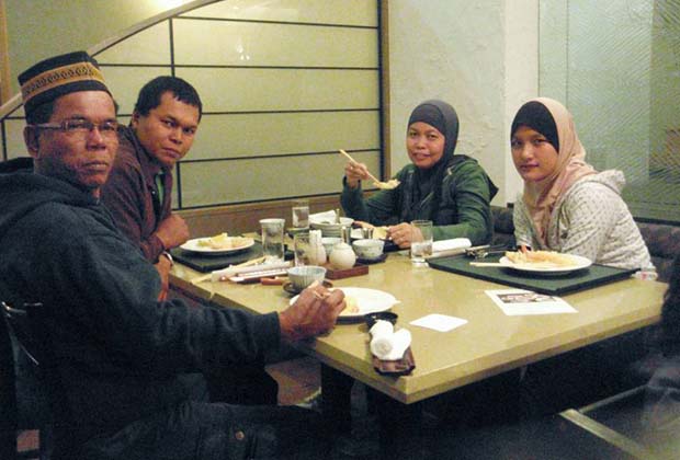A group of Malaysian tourists enjoy Japanese food prepared in accordance with Islamic laws at Rusutsu Resort Hotel, Hokkaido, Japan